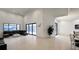 Bright, open-concept living room with tile flooring, and a modern sectional sofa at 432 Gun Cay Ln, Punta Gorda, FL 33950