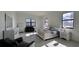 Bright main bedroom featuring ample natural light, elegant furnishings, and a calm atmosphere at 432 Gun Cay Ln, Punta Gorda, FL 33950