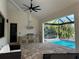 Beautiful outdoor area with grill, pool, and water view at 432 Gun Cay Ln, Punta Gorda, FL 33950