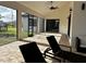 Relaxing covered patio with comfortable seating and brick flooring at 432 Gun Cay Ln, Punta Gorda, FL 33950