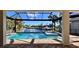 Beautiful screened-in pool and spa overlooking a serene canal with dock and boat lift at 432 Gun Cay Ln, Punta Gorda, FL 33950