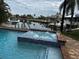 Inviting pool and hot tub with waterfront views and boat lift access at 432 Gun Cay Ln, Punta Gorda, FL 33950