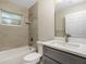 Bathroom featuring shower and bathtub with light tile walls, vanity with modern fixtures at 4754 Caputo Ave, North Port, FL 34288