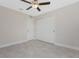 Bedroom featuring neutral walls, tile floors, ceiling fan, and a closet with sliding doors at 4754 Caputo Ave, North Port, FL 34288