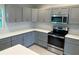 Well-equipped kitchen featuring ample counter space and modern appliances at 4754 Caputo Ave, North Port, FL 34288