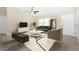 Contemporary living room with a neutral color palette and modern furniture at 4754 Caputo Ave, North Port, FL 34288