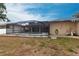 Backyard with pool area, white vinyl fence, and side view of home at 4788 Abadan St, North Port, FL 34287