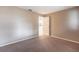Bedroom boasting neutral walls, carpeted floors, and an open doorway to the home's common areas at 4788 Abadan St, North Port, FL 34287