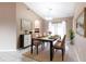 Open dining area featuring modern decor, tile floors, and natural light at 4788 Abadan St, North Port, FL 34287