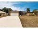 Charming single-story home featuring a two-car garage, screened entry and well-maintained landscaping at 4788 Abadan St, North Port, FL 34287