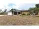 Exterior of home with driveway, attached garage, and partial lawn at 4788 Abadan St, North Port, FL 34287