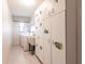 The Laundry Room features white cabinets with sea life decor, sink, washer, and dryer at 4788 Abadan St, North Port, FL 34287