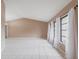 Bright living room with vaulted ceilings, neutral walls, and an abundance of natural light at 4788 Abadan St, North Port, FL 34287