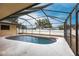 Outdoor pool area with screen enclosure and bright sunlight at 4788 Abadan St, North Port, FL 34287