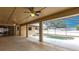 Covered patio area overlooking pool and backyard with ceiling fans at 4788 Abadan St, North Port, FL 34287