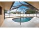 Enclosed in-ground pool with a screened-in lanai, providing a private backyard oasis at 4788 Abadan St, North Port, FL 34287