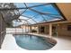 Screened pool area with concrete deck and pool entry steps at 4788 Abadan St, North Port, FL 34287