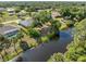 Beautiful aerial view of the backyard and surrounding canal, showcasing the serene waterfront setting at 485 Dorchester St, Port Charlotte, FL 33954
