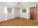 Bedroom featuring carpet, a ceiling fan, and two windows at 485 Dorchester St, Port Charlotte, FL 33954
