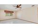 Bright bedroom features tile floors, a ceiling fan, and a window with valance at 485 Dorchester St, Port Charlotte, FL 33954