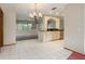 Charming dining area features tiled floors, chandelier, and abundant natural light at 485 Dorchester St, Port Charlotte, FL 33954