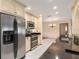 Modern kitchen with stainless steel appliances, black countertops, and white cabinets at 485 Dorchester St, Port Charlotte, FL 33954