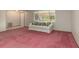 Comfortable living room with plush pink carpeting and a sofa at 485 Dorchester St, Port Charlotte, FL 33954
