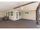 Large screened lanai with fan, carpeting, and ample space for dining and relaxing at 485 Dorchester St, Port Charlotte, FL 33954