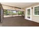 Expansive screened lanai features an exit door, a ceiling fan, and a view of the outdoors at 485 Dorchester St, Port Charlotte, FL 33954
