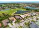 Beautiful home with screened lanai, lush landscaping, and views of the golf course and lake at 5461 White Ibis Dr, North Port, FL 34287