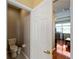 Bathroom access featuring the toilet and tile flooring at 5461 White Ibis Dr, North Port, FL 34287