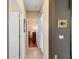 Hallway view displaying the interior doors and access to the home's living spaces at 5461 White Ibis Dr, North Port, FL 34287