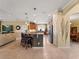 Bright, open kitchen with granite countertops, a central island with barstool seating at 5461 White Ibis Dr, North Port, FL 34287