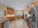 Spacious kitchen with stainless steel appliances and ample cabinet space at 5461 White Ibis Dr, North Port, FL 34287