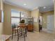 Cozy breakfast nook in kitchen with a view to the outside, complemented by ample cabinets at 5461 White Ibis Dr, North Port, FL 34287