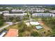 Aerial shot featuring a community pool, bocce ball court, and landscaped grounds at 6070 80Th N St # 215, St Petersburg, FL 33709