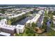 Aerial view of a condo building near a lake and residential areas at 6070 80Th N St # 215, St Petersburg, FL 33709