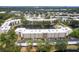 Aerial view of the property with a lake and surrounding trees at 6070 80Th N St # 215, St Petersburg, FL 33709
