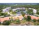 Aerial view of condo community with mature trees and landscaping at 6070 80Th N St # 215, St Petersburg, FL 33709