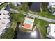 Aerial view of the community featuring a community pool overlooking a lake at 6070 80Th N St # 215, St Petersburg, FL 33709