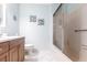 Bathroom with a shower-tub combo, white tile, and a wood vanity at 6070 80Th N St # 215, St Petersburg, FL 33709