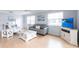 Comfortable living room featuring hardwood flooring, neutral paint and plenty of natural light at 6070 80Th N St # 215, St Petersburg, FL 33709