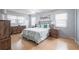Serene bedroom retreat with wood floors, natural light, and relaxing decor at 6070 80Th N St # 215, St Petersburg, FL 33709