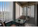 Sun room featuring a glass table, two chairs and light-filtering window shades at 6070 80Th N St # 215, St Petersburg, FL 33709