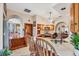 Beautiful kitchen features barstool seating at the counter and arched doorway to the dining area at 6242 Tropicaire Blvd, North Port, FL 34291