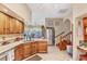 Bright kitchen featuring wood cabinets, granite countertops, stainless steel appliances and breakfast nook at 6242 Tropicaire Blvd, North Port, FL 34291