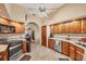 Well-equipped kitchen features stainless appliances, and an arched doorway to the dining room at 6242 Tropicaire Blvd, North Port, FL 34291