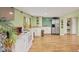Kitchenette with white appliances, tile floors, ample cabinet space, and a window for natural light at 6242 Tropicaire Blvd, North Port, FL 34291