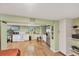 Kitchenette with white appliances, tile floors, ample cabinet space, and a window for natural light at 6242 Tropicaire Blvd, North Port, FL 34291