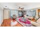 Cozy living room with wood floors, comfortable seating, and natural light at 6242 Tropicaire Blvd, North Port, FL 34291